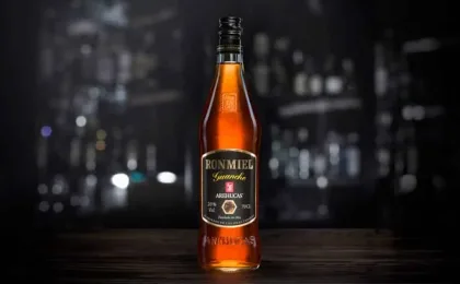 Bottle and glass of Canary Islands Ronmiel served as a traditional liqueur