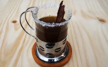 Hot Canelazo cocktail served with cinnamon in the Andean highlands