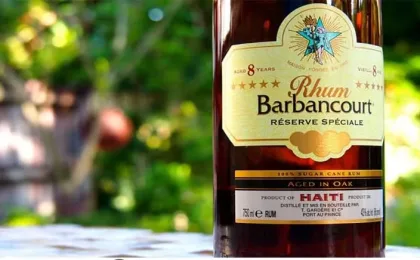 Image of Haitian Barbancourt rum with Haiti landscape and tradition