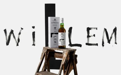 Botella de Laphroaig Willem by Willem en una ambientación de whisky ahumado